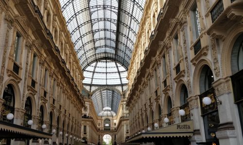 Private Italian courses in Milan - student walking in a street passage