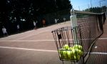 Tennis and French summer camps in France - collecting yellow balls