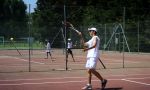 Tennis and French summer camps in France - young player concentrating on gestures