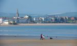 High School Study Abroad in England- students walking on the beach